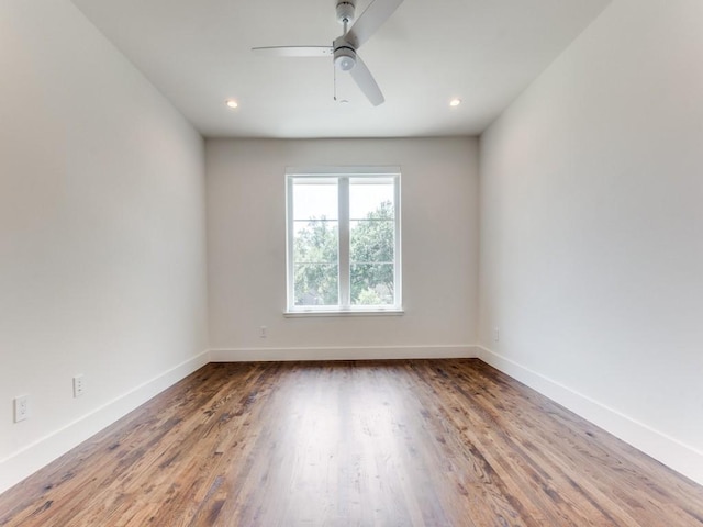 empty room featuring recessed lighting, ceiling fan, baseboards, and wood finished floors