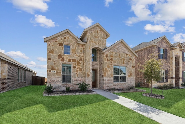 view of front of home featuring a front yard, stone siding, and brick siding