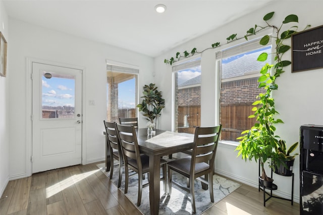 dining area featuring wood finished floors and baseboards