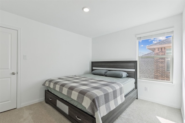 bedroom featuring carpet floors and baseboards