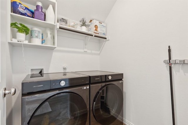 clothes washing area featuring laundry area and separate washer and dryer