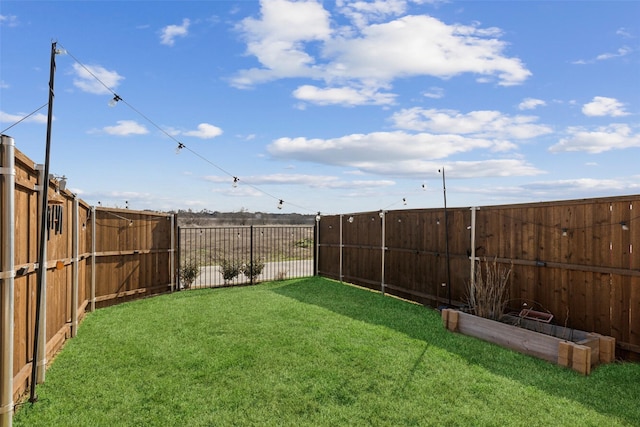 view of yard featuring a fenced backyard