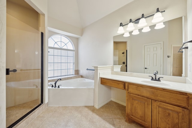 full bathroom with a stall shower, tile patterned flooring, a garden tub, and vanity