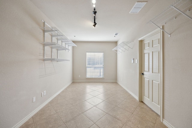 walk in closet featuring light tile patterned floors and visible vents