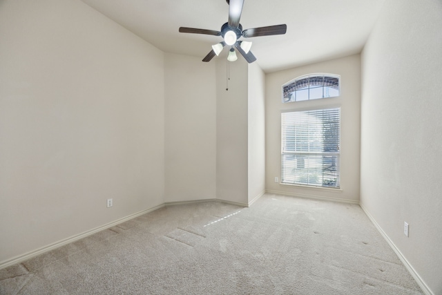 unfurnished room with carpet, ceiling fan, and baseboards