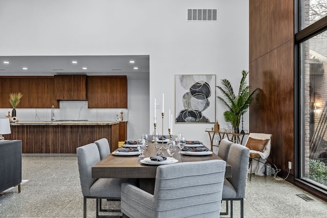 dining area with light speckled floor, visible vents, and recessed lighting