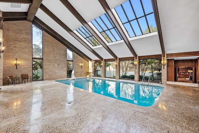 pool with a lanai and a patio area