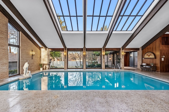 indoor pool featuring a skylight