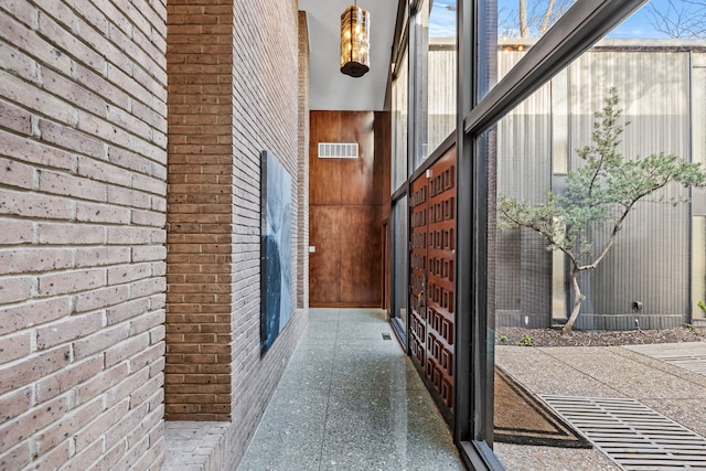 doorway to property with visible vents