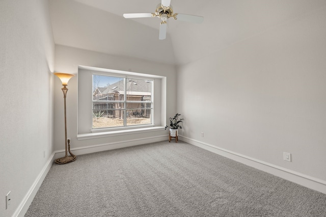 unfurnished room featuring baseboards, lofted ceiling, carpet, and a ceiling fan