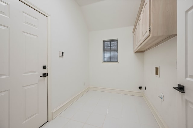 laundry area with cabinet space, hookup for a washing machine, and baseboards