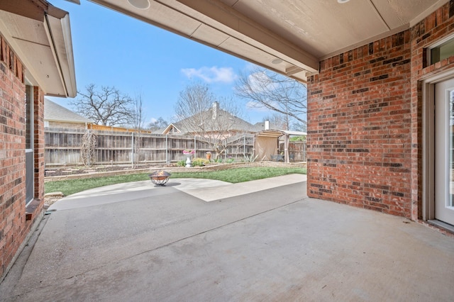 view of patio featuring fence