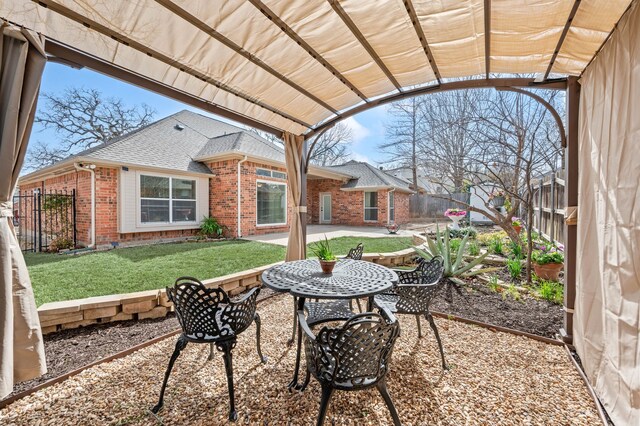 view of patio / terrace featuring a fenced backyard and a pergola