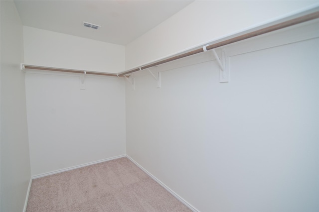 spacious closet featuring carpet and visible vents