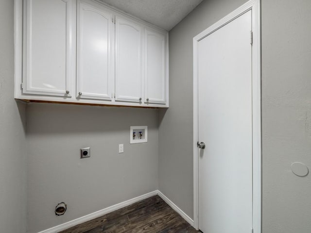 laundry room featuring washer hookup, dark wood-style flooring, cabinet space, hookup for an electric dryer, and baseboards