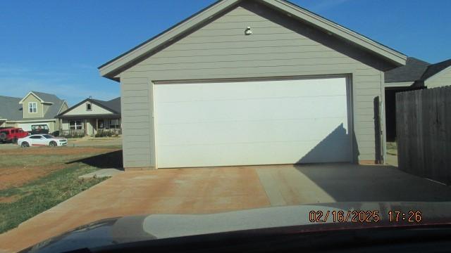 garage featuring fence