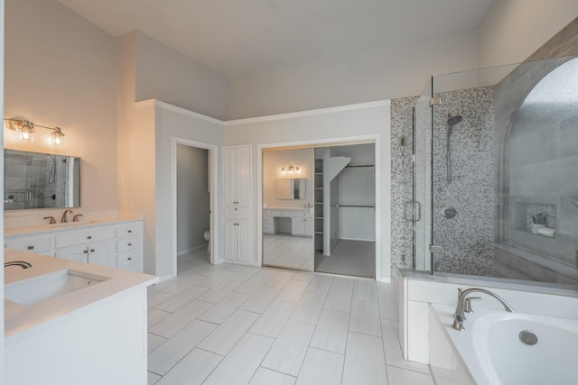 bathroom featuring toilet, a stall shower, and vanity