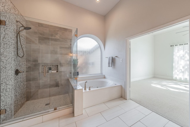 full bath with a stall shower, tile patterned flooring, and a garden tub