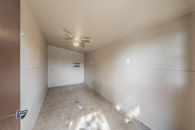 bonus room featuring concrete flooring, a wall mounted AC, and a ceiling fan