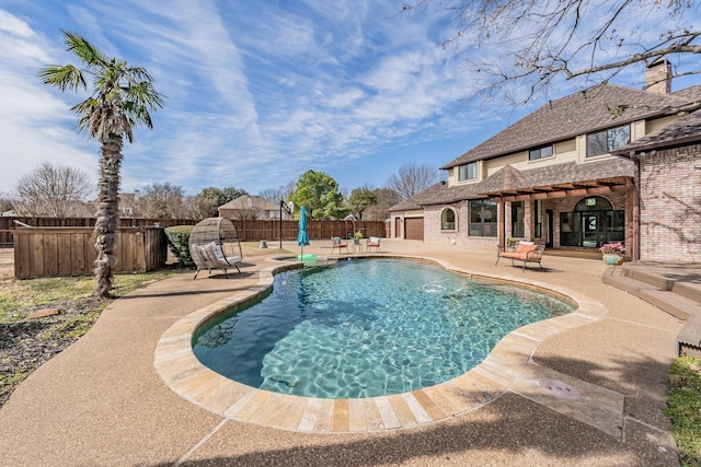 view of swimming pool featuring a fenced in pool, a patio area, and a fenced backyard