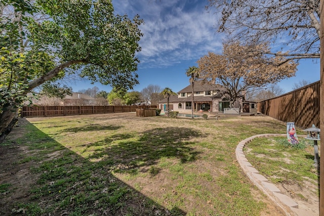 view of yard with a fenced backyard