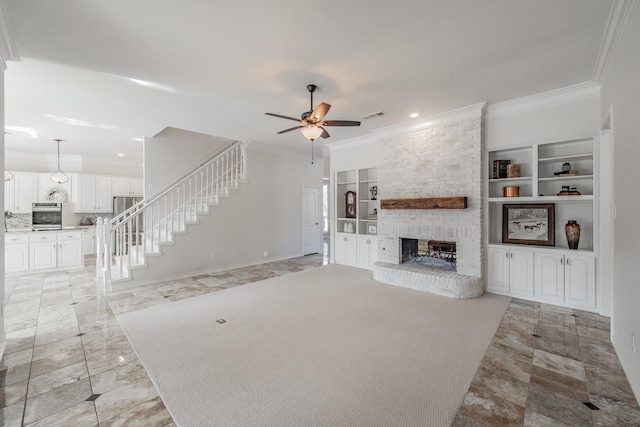 unfurnished living room featuring visible vents, a ceiling fan, stairs, crown molding, and a fireplace