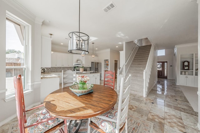 dining space featuring recessed lighting, visible vents, ornamental molding, baseboards, and stairs