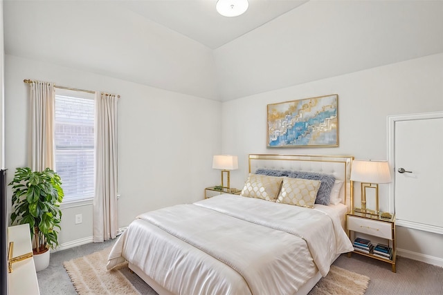 bedroom with baseboards, carpet, and lofted ceiling