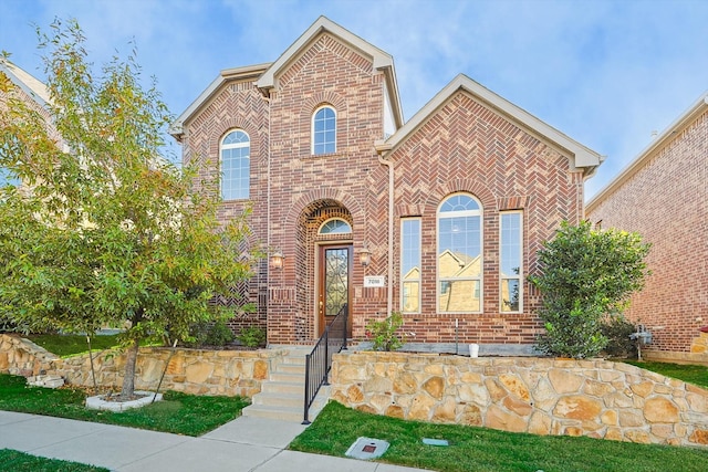 view of front facade featuring brick siding