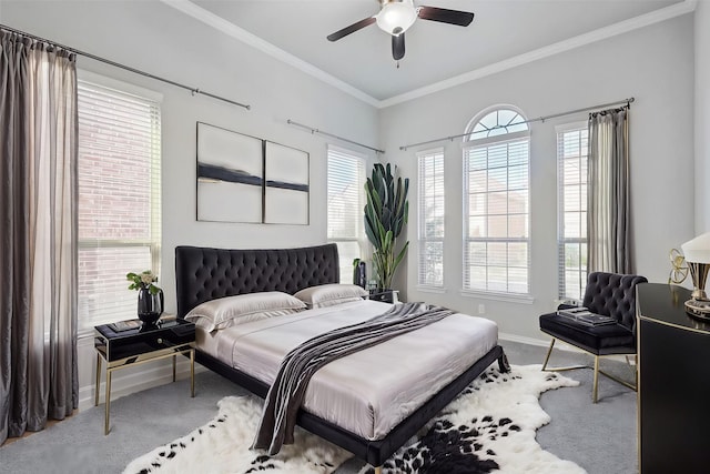 bedroom featuring baseboards, crown molding, carpet floors, and ceiling fan