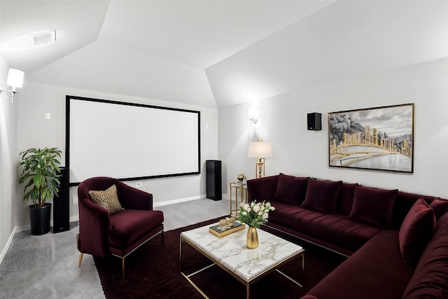 cinema featuring baseboards, visible vents, and vaulted ceiling