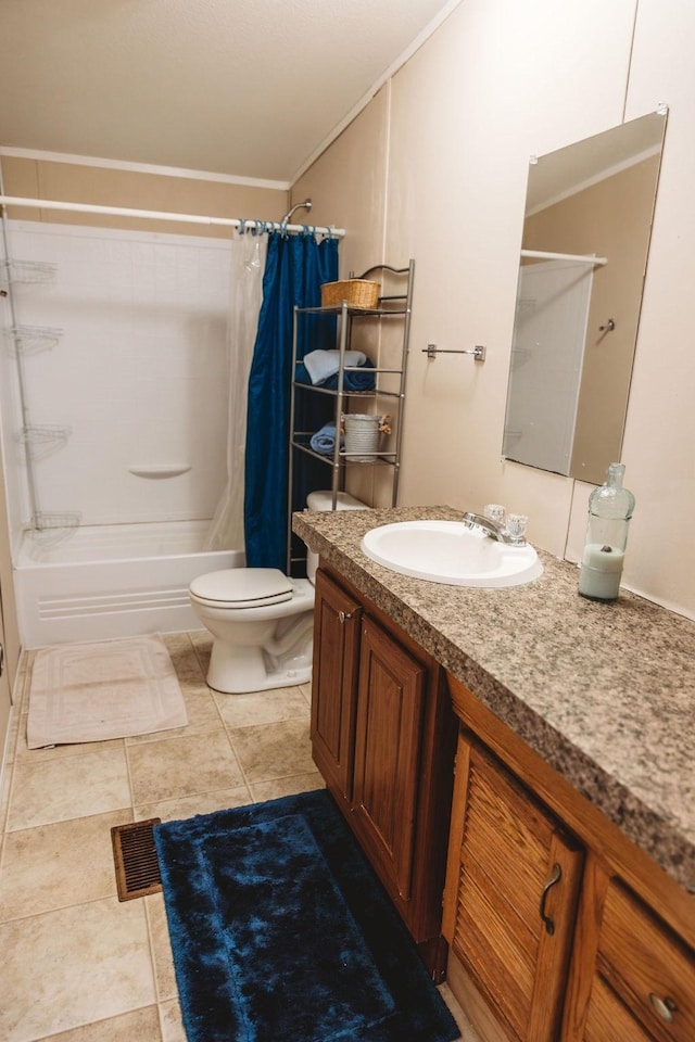 full bathroom featuring toilet, tile patterned flooring, crown molding, and vanity