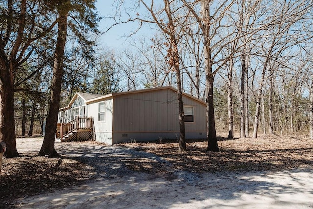 view of side of home with crawl space