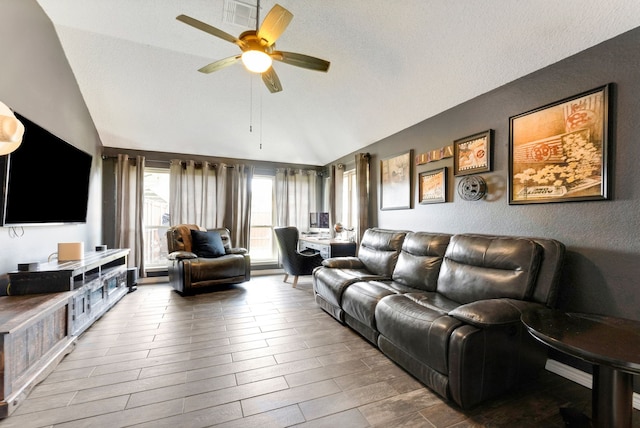 living room with wood finished floors, vaulted ceiling, and ceiling fan