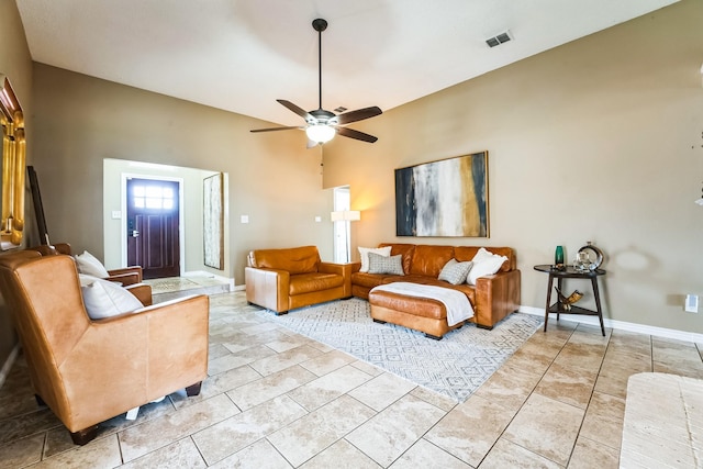 living room featuring visible vents, ceiling fan, baseboards, and light tile patterned floors