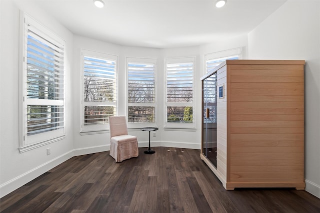 unfurnished room featuring dark wood-type flooring, recessed lighting, and baseboards