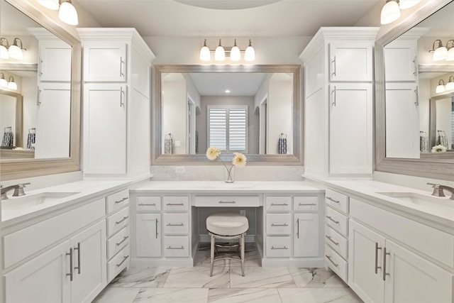 bathroom with marble finish floor and vanity