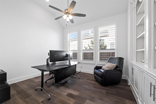 office area featuring lofted ceiling, dark wood-type flooring, baseboards, and a healthy amount of sunlight