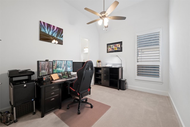 office featuring high vaulted ceiling, light colored carpet, ceiling fan, and baseboards