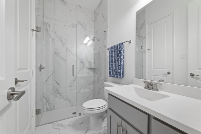 full bathroom featuring toilet, marble finish floor, a marble finish shower, and vanity