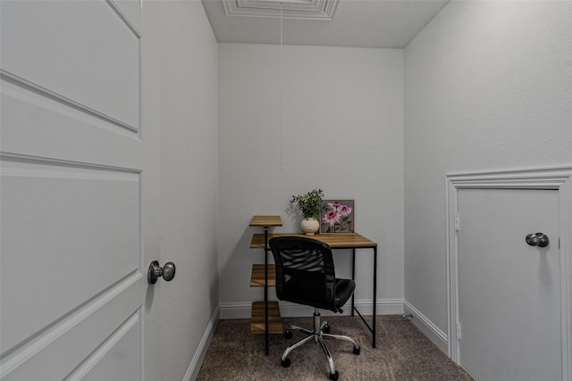 carpeted office space featuring attic access and baseboards