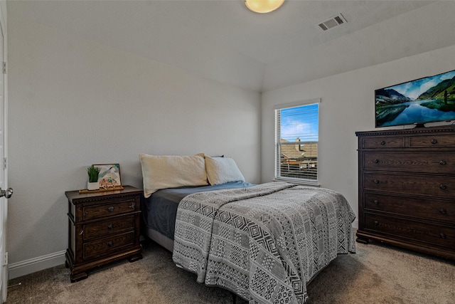 bedroom featuring lofted ceiling, carpet, and visible vents