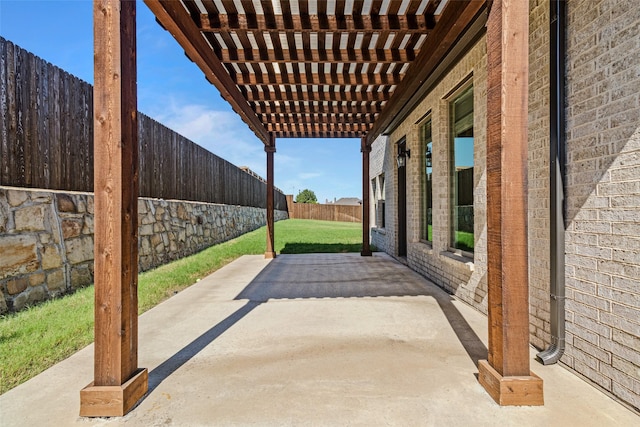 view of patio featuring a fenced backyard and a pergola