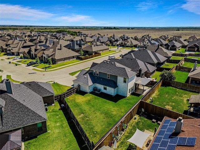 birds eye view of property with a residential view