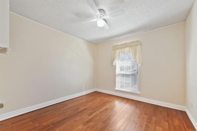 empty room featuring a ceiling fan, a textured ceiling, baseboards, and hardwood / wood-style floors