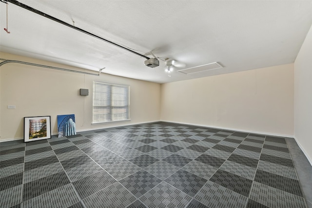 empty room featuring baseboards and dark carpet