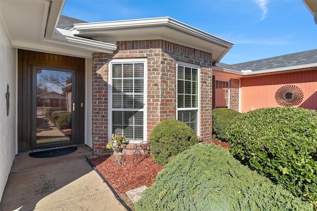 entrance to property with brick siding