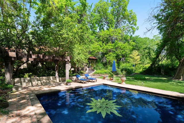 outdoor pool featuring a patio area and a lawn