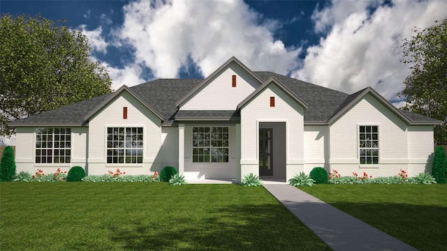 view of front of house with a front lawn and roof with shingles