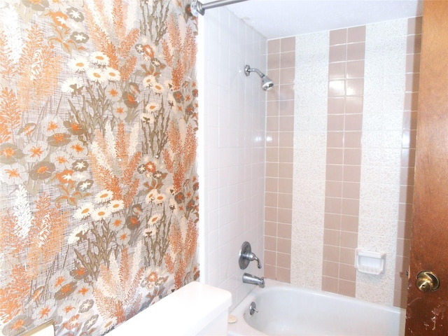 bathroom with shower / bath combo with shower curtain and toilet